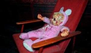 Dead doll in a chair